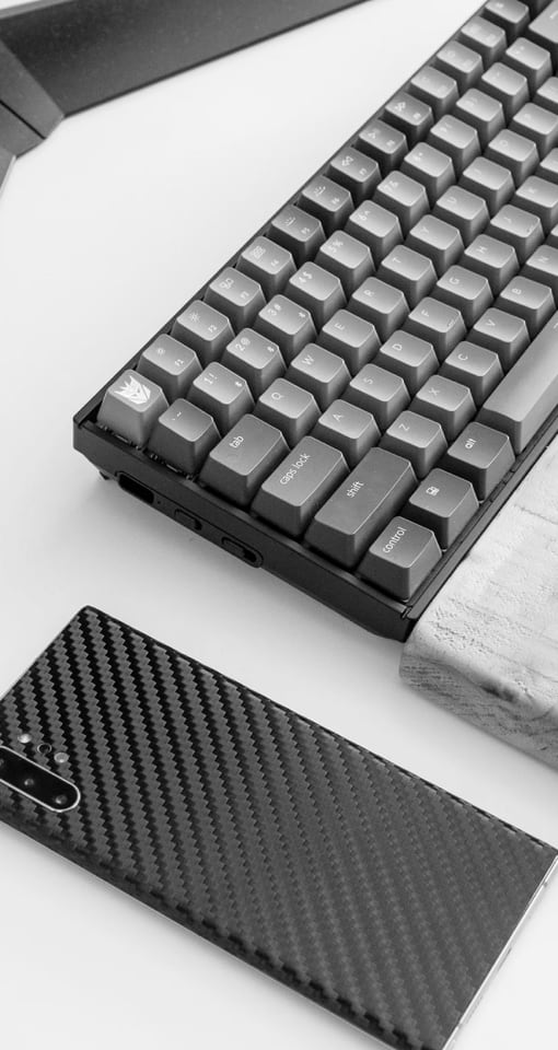 Typemaster mechanical keyboard next to a smartphone